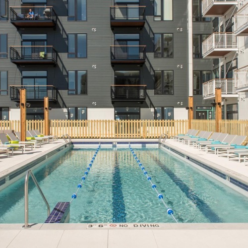 Shimmering resort-style pool rooftop pool with lap lanes