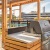 a grill on rooftop deck with city views