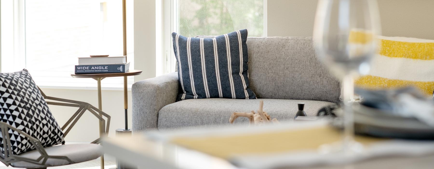 a living room with a couch and a table